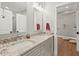 Bathroom with double vanity, granite countertops, and views of the adjacent yoga room at 119 November Dr, Durham, NC 27712