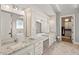 This spacious bathroom features double vanities, granite countertops, and access to the walk-in closet at 119 November Dr, Durham, NC 27712