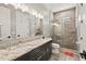 Modern bathroom with double vanity, granite countertops, and glass shower at 119 November Dr, Durham, NC 27712
