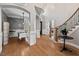 Spacious foyer with wood floors, archways to the dining room, and a curved staircase at 119 November Dr, Durham, NC 27712