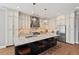 Spacious kitchen with granite countertops, a large island, and stainless steel appliances at 119 November Dr, Durham, NC 27712