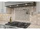 Close-up of kitchen features including a pot filler and custom backsplash at 119 November Dr, Durham, NC 27712