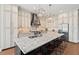 Well-appointed kitchen boasts granite countertops, island, and stainless steel appliances at 119 November Dr, Durham, NC 27712