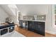 The modern kitchenette offers a sleek sink and countertop with plenty of storage at 119 November Dr, Durham, NC 27712