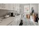 Well-lit laundry room with ample counter space and modern appliances at 119 November Dr, Durham, NC 27712