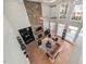 Spacious living room with stone fireplace and large windows filling the room with natural light at 119 November Dr, Durham, NC 27712