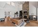 Spacious living room with tall ceilings, stone fireplace, hardwood floors, and modern furnishings at 119 November Dr, Durham, NC 27712