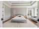 This beautiful main bedroom features hardwood floors, tray ceilings, and plenty of natural light at 119 November Dr, Durham, NC 27712