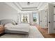 This beautiful bedroom features a tray ceiling, hardwood floors, and lots of natural light at 119 November Dr, Durham, NC 27712