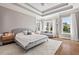 The main bedroom features a trey ceiling, hardwood floors, and a seating area at 119 November Dr, Durham, NC 27712