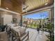 Covered patio with comfortable seating and views of the backyard and neighborhood at 119 November Dr, Durham, NC 27712