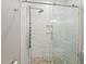 Modern walk-in shower featuring sleek glass doors and stylish tile work at 119 November Dr, Durham, NC 27712