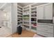 This walk-in closet offers custom shelving, drawers, and easy access to the bathroom at 119 November Dr, Durham, NC 27712
