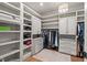 This spacious walk-in closet offers custom shelving, drawers, and room for storage at 119 November Dr, Durham, NC 27712
