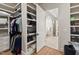 This walk-in closet offers custom shelving, drawers, and easy access to the bathroom at 119 November Dr, Durham, NC 27712