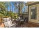 Relaxing back deck featuring outdoor seating, lush foliage, and tranquil outdoor living at 131 Long Shadow Ln, Cary, NC 27518