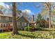 Spacious backyard featuring a lovely wood deck, mature trees, and well-maintained landscaping at 131 Long Shadow Ln, Cary, NC 27518