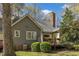 Well-maintained backyard features a deck, lush greenery, and mature trees for privacy at 131 Long Shadow Ln, Cary, NC 27518