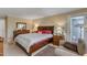 Comfortable bedroom with a king-size bed, nightstands, lamps, and natural light at 131 Long Shadow Ln, Cary, NC 27518