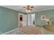 Bright bedroom featuring a view into the en-suite bath, neutral walls, and a ceiling fan for added comfort at 131 Long Shadow Ln, Cary, NC 27518