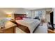 Cozy bedroom featuring a large bed, soft lighting, and a window with natural light at 131 Long Shadow Ln, Cary, NC 27518