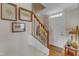 Entryway showcasing a white front door, hardwood floors, and a staircase at 131 Long Shadow Ln, Cary, NC 27518