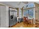 Bright kitchen featuring stainless steel refrigerator, and an adjacent dining area at 131 Long Shadow Ln, Cary, NC 27518