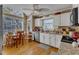 Bright kitchen featuring white cabinets, granite countertops, and stainless steel appliances at 131 Long Shadow Ln, Cary, NC 27518