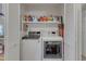 Convenient laundry room with a washer, dryer, and storage shelves at 131 Long Shadow Ln, Cary, NC 27518