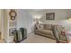 Comfortable living room with a neutral-toned sofa, decorative pillows, and ample storage space with large closets at 131 Long Shadow Ln, Cary, NC 27518