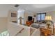 Inviting upstairs living area with a comfortable sectional sofa, television, and cozy decor at 131 Long Shadow Ln, Cary, NC 27518