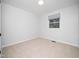 Bedroom with neutral carpet, and a window at 1402 Valley Rd, Garner, NC 27529
