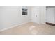 Cozy bedroom with a window and neutral carpet at 1402 Valley Rd, Garner, NC 27529