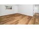 A bright bedroom with hardwood floors, white walls, and natural light, a cozy retreat at 1402 Valley Rd, Garner, NC 27529