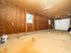 Spacious garage ready for painting with an insulated unfinished design, offering ample storage and workspace at 1402 Valley Rd, Garner, NC 27529