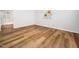 Cozy room with vinyl floors, white walls and ceiling fan, bright space at 1402 Valley Rd, Garner, NC 27529