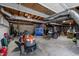 Spacious basement with concrete floors and exposed wooden ceiling, with ample storage and workspace for hobbies at 1507 Ridgeway Ave, Durham, NC 27701