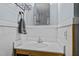 Modern bathroom with a stylish sink, mirror, and decorative towel rack at 1507 Ridgeway Ave, Durham, NC 27701