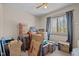 Box-filled bedroom with a window offering ample natural light, and carpeted floors at 1507 Ridgeway Ave, Durham, NC 27701