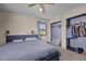 Bedroom with a cozy bed, ample closet space, and a sunny window at 1507 Ridgeway Ave, Durham, NC 27701