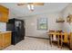 Kitchen and dining area combination with wood cabinets at 1507 Ridgeway Ave, Durham, NC 27701