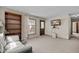 Cozy living room featuring carpet floors and a large window at 1507 Ridgeway Ave, Durham, NC 27701