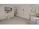 Spacious open concept room with tv, carpet floors, and natural light at 1507 Ridgeway Ave, Durham, NC 27701