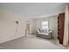 Open living room layout featuring neutral carpet and natural light at 1507 Ridgeway Ave, Durham, NC 27701