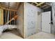 Unfinished attic area with door and exposed insulation at 151 S Harper Faith Way, Benson, NC 27504