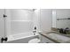 Bright bathroom features white tub with tile walls and a granite vanity at 151 S Harper Faith Way, Benson, NC 27504