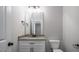 Bathroom with a granite vanity top, toilet, and silver accents at 151 S Harper Faith Way, Benson, NC 27504