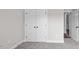 Bedroom featuring neutral carpet and large double door closet with matte black hardware at 151 S Harper Faith Way, Benson, NC 27504
