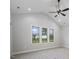 Bright bedroom featuring vaulted ceiling, neutral paint, carpet and many windows for lots of natural light at 151 S Harper Faith Way, Benson, NC 27504