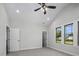 Spacious bedroom offers neutral paint, carpet, doors, and windows providing natural light at 151 S Harper Faith Way, Benson, NC 27504